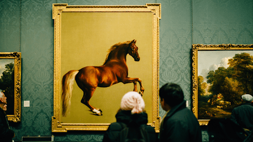 Fine art gallery with a framed painting of a horse